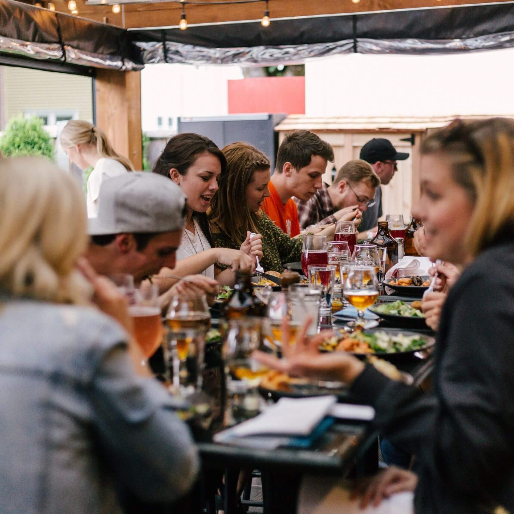 people eating outdoors at a restaurant