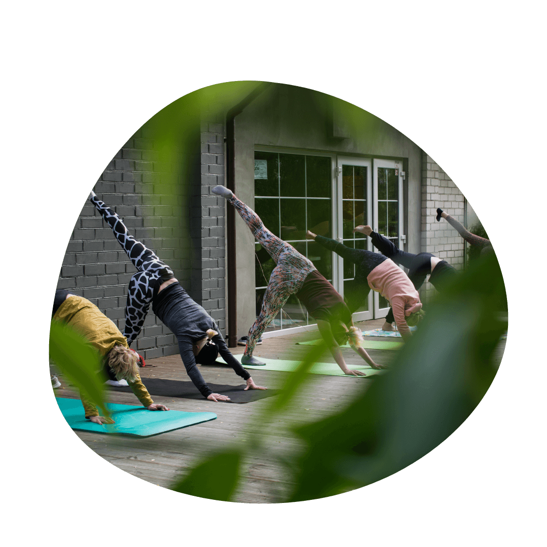 People practicing yoga outside